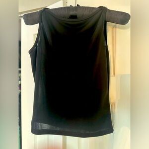 Black, high neckline shirt. sleeveless. Wear with jeans, skirt or business suit